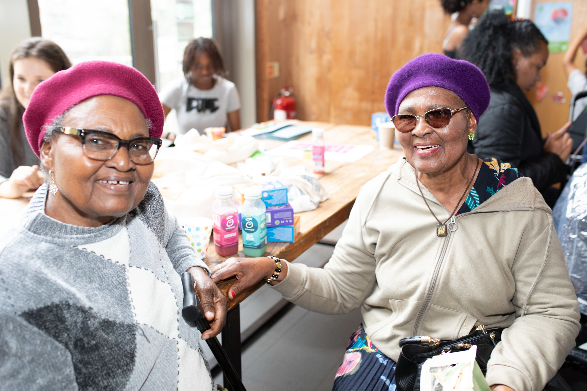 Two older women smiling at the camera