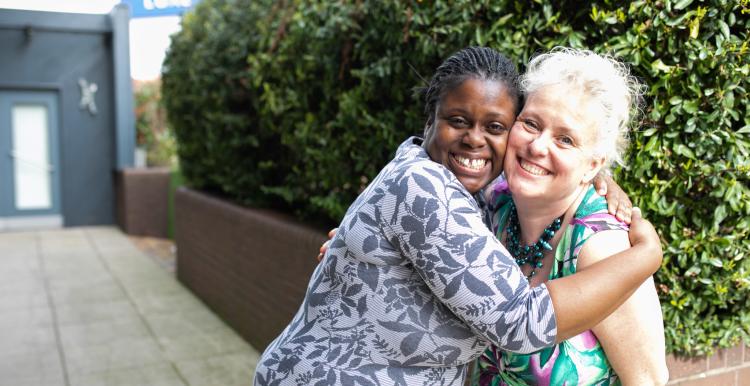 Women hugging. 