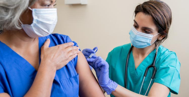 person having their covid vaccine