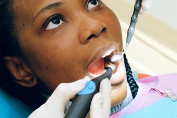 Woman being treated by a dentist